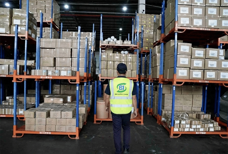 warehouse staff managing inventory in thailand fulfillment warehouse with storage racks