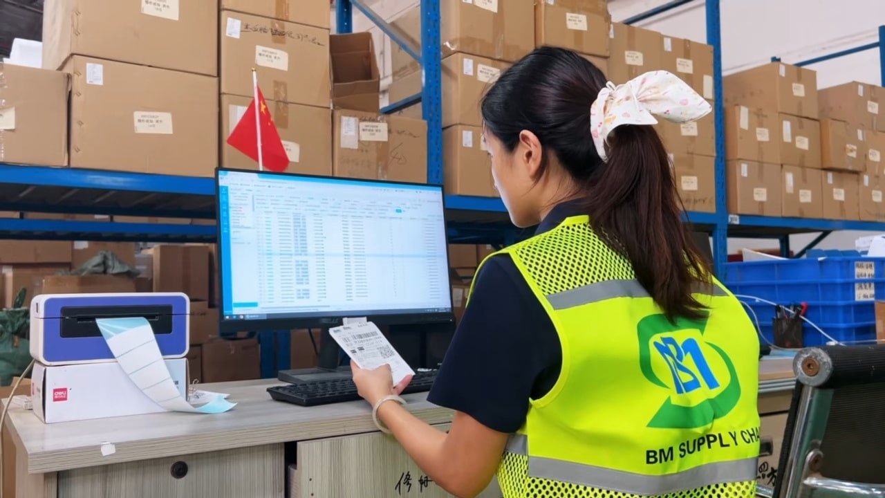 warehouse staff using inventory management system and barcode scanning for order fulfillment