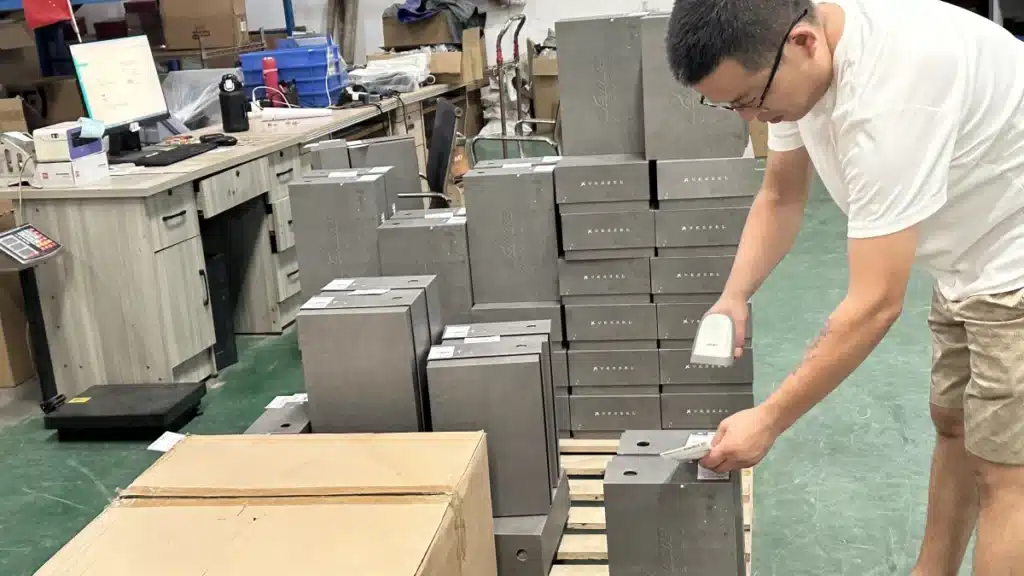 Warehouse worker scanning product labels for inventory verification and order fulfillment as part of professional warehousing services.