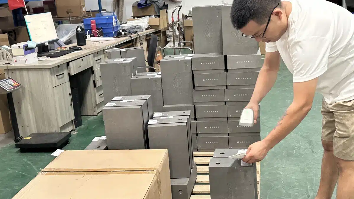 Warehouse worker scanning product labels for inventory verification and order fulfillment as part of professional warehousing services.