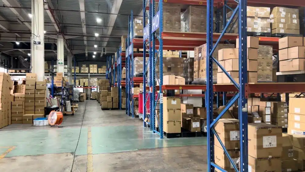 Organized 3PL warehouse racks with stored cartons showing inventory storage and scalable eCommerce fulfillment operations.