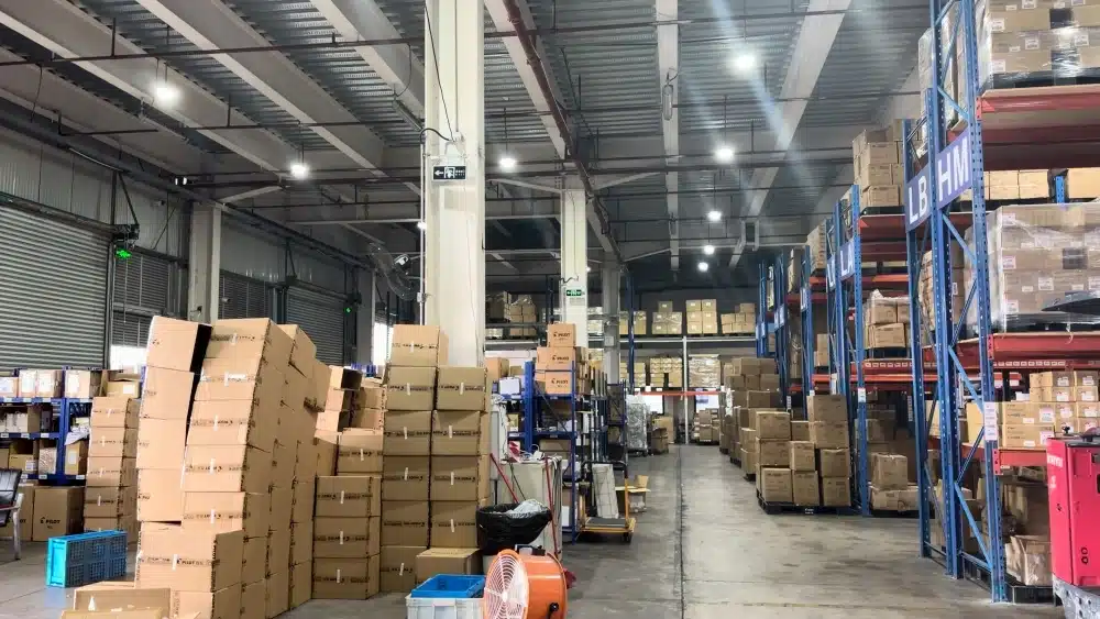 Large 3PL warehouse with organized inventory and storage racks providing scalable warehousing services for eCommerce businesses