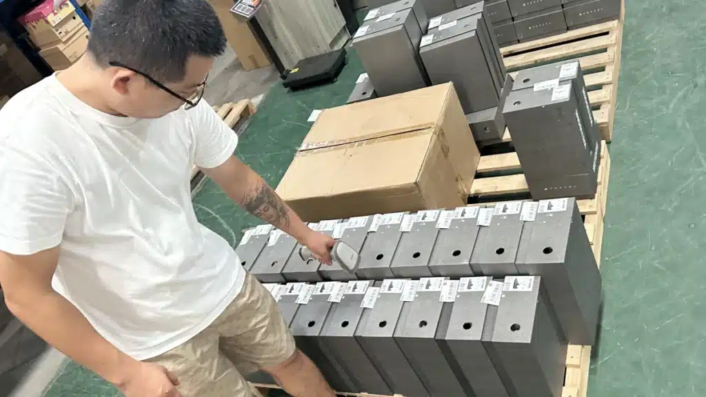 Warehouse worker scanning product labels during pick and pack fulfillment to verify items, improve order accuracy, and reduce shipping errors.