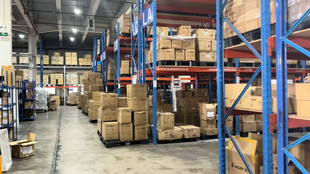Organized China warehouse with pallet racks and stored cartons supporting cost-effective inventory storage and cross-border eCommerce fulfillment