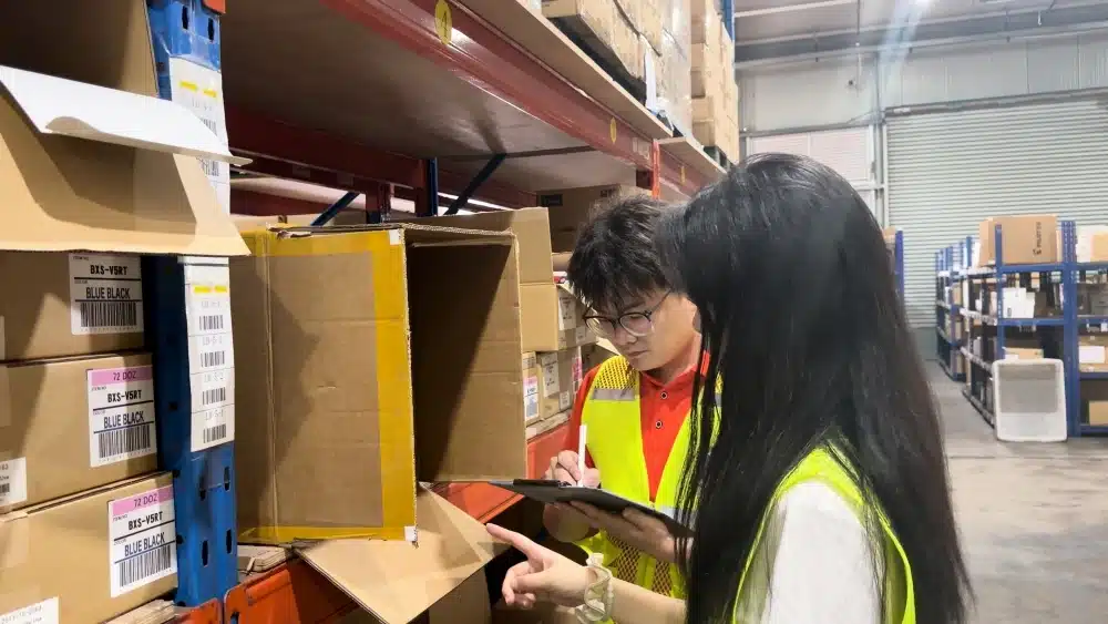 Warehouse staff checking inventory and product locations for accurate pick and pack fulfillment services in China