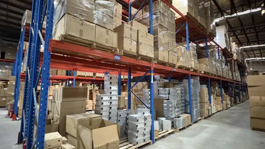 Palletized cartons stored on industrial warehouse racks, showing how pallet space, storage volume, and inventory duration influence warehouse storage costs.