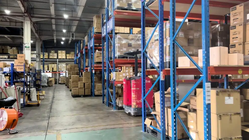 Organized eCommerce warehouse with inventory racks supporting efficient pick and pack fulfillment, storage, and order processing