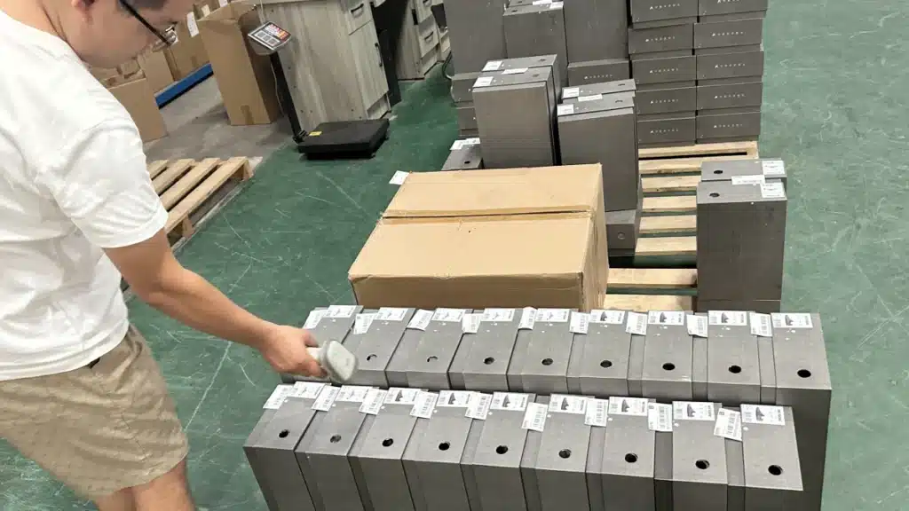 Warehouse worker scanning labeled products to verify customer orders before packing and shipping, supporting an accurate pick and pack fulfillment workflow.