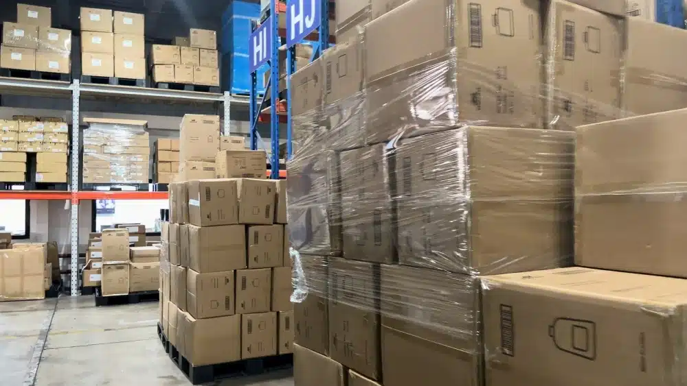 Palletized eCommerce inventory stored in a fulfillment warehouse for scalable pick and pack order processing and faster shipping