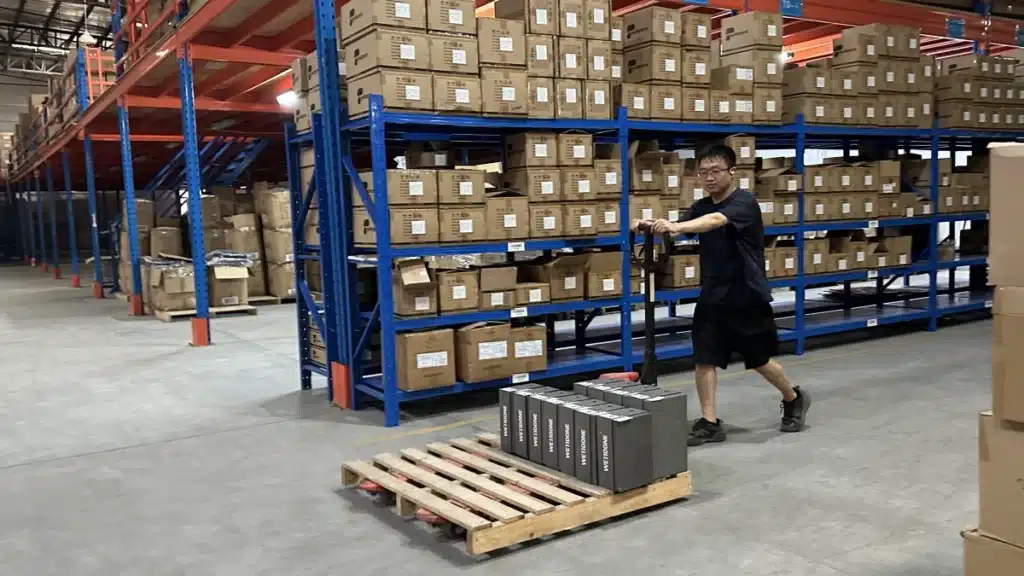 Warehouse worker moving TikTok Shop inventory on a pallet as part of 3PL warehousing, order fulfillment, and shipping operations.