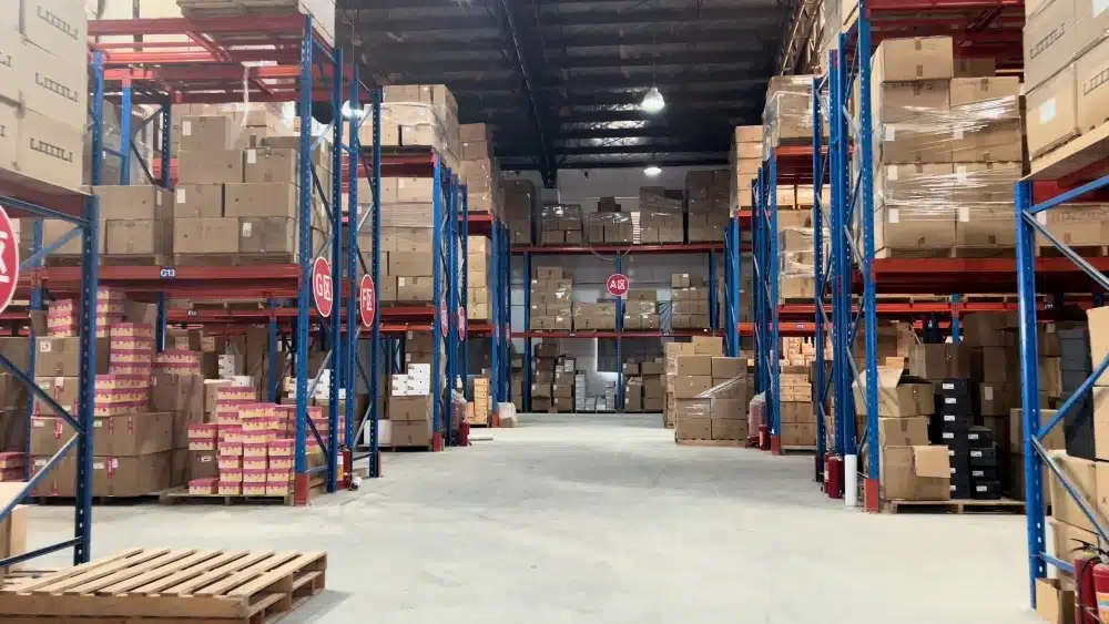 Organized eCommerce fulfillment warehouse with inventory racks supporting lower fulfillment costs and profitable free shipping