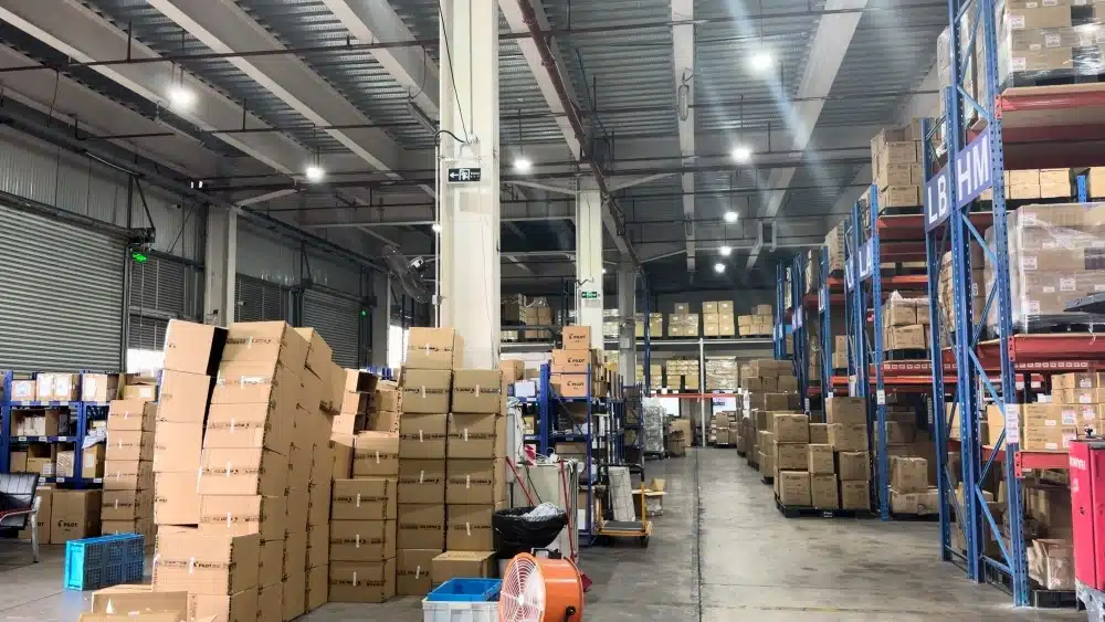 Organized eCommerce fulfillment warehouse with inventory storage and order processing areas designed to reduce shipping delays