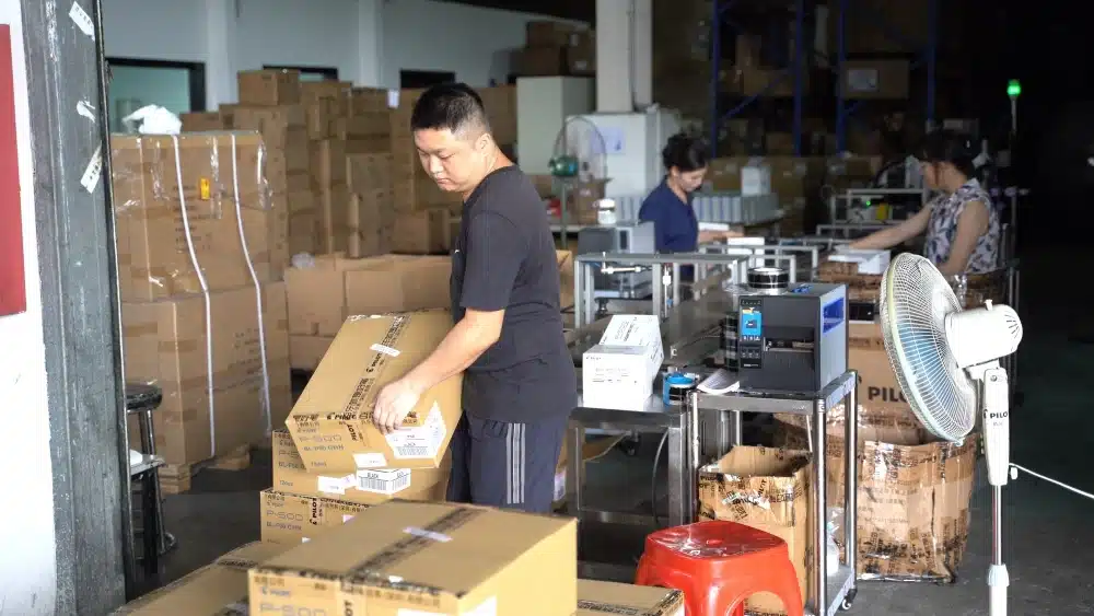 Warehouse worker picking products from organized storage racks for eCommerce pick and pack fulfillment services