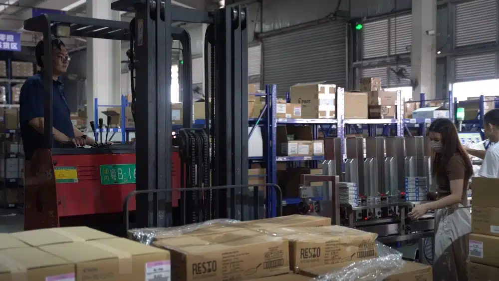 Warehouse fulfillment team processing eCommerce orders to support accurate real-time order tracking and post-purchase updates