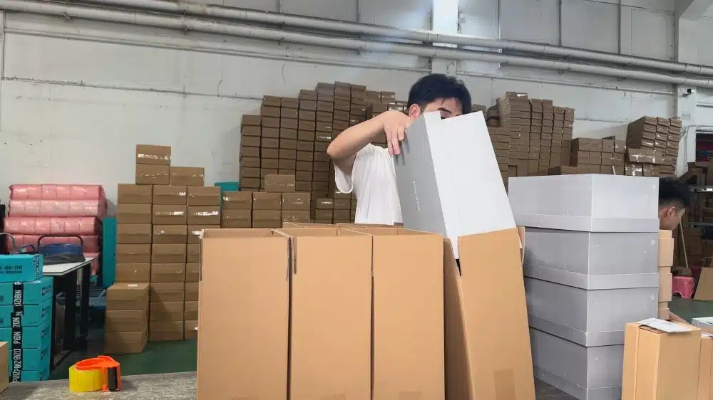 Warehouse staff preparing products in boxes for 3PL fulfillment and inventory management services for online sellers