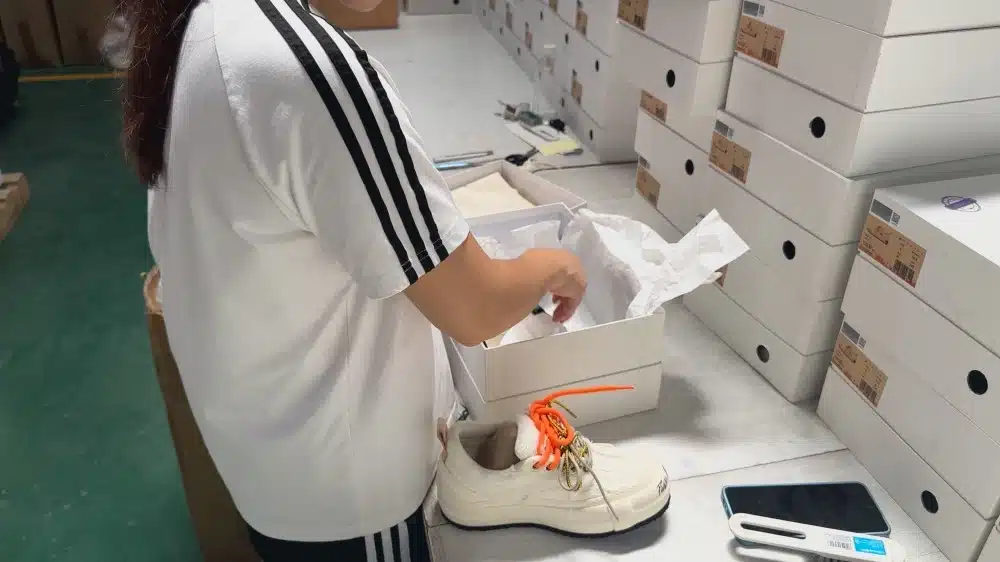 Warehouse worker packing products for ecommerce fulfillment comparing Amazon FBA and third party logistics (3PL) warehousing services