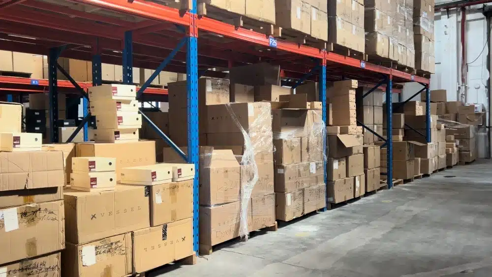 Warehouse shelves filled with cardboard cartons representing FSC certified packaging storage and sustainable ecommerce fulfillment operations in China