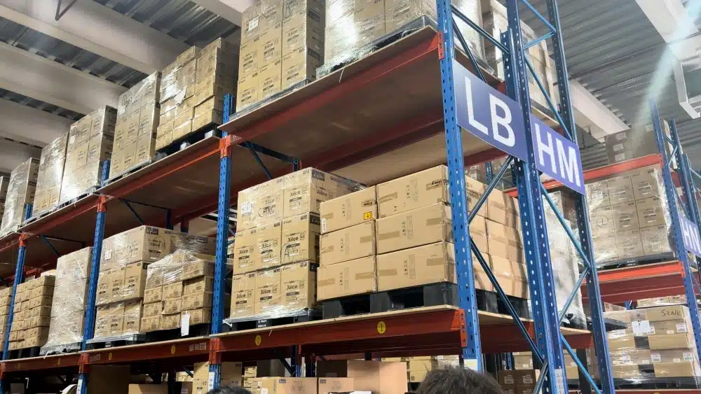 Warehouse worker picking ecommerce orders in a fulfillment center to improve TikTok Shop dispatch speed and reduce Late Dispatch Rate