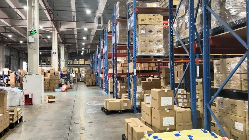 Warehouse staff inspecting inventory to support carbon neutral shipping, fulfillment accuracy, and sustainable supply chain management