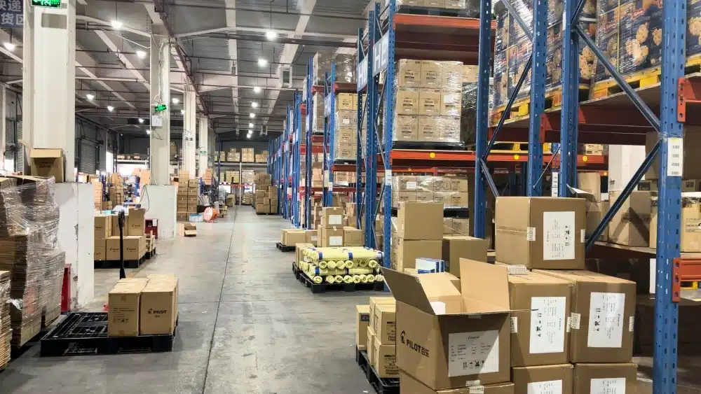 Warehouse staff managing inventory in a fulfillment center that supports green fulfillment certification and sustainable ecommerce supply chain practices