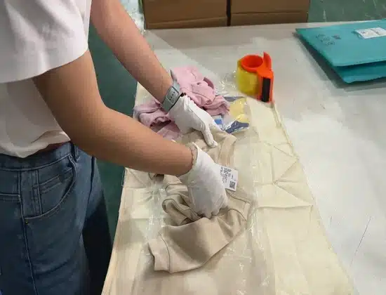 warehouse worker preparing custom packaging and kitting services for branded dropshipping fulfillment orders